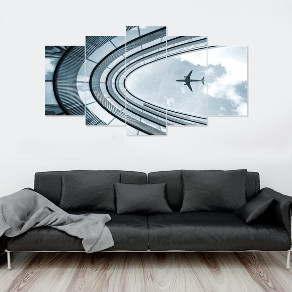 Airplane Flying Over Building 5 Piece Canvas Wall Art